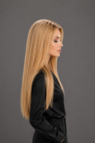 Woman wearing Bespoke Human Hair Wig by PUSH 20" in color Miel with black blouse and pants. Right side view.