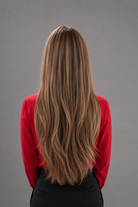 Woman wearing a Bespoke Human Hair Wig by PUSH in color Jolie and a red colored button down blouse with black pants. Back view.