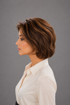 Woman wearing Bespoke Human Hair Wig by PUSH in color Noisette with a button down cream blouse. Left side view.