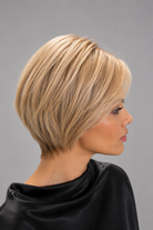 Woman wearing short human hair wig by PUSH in color Champagne Rooted | Right side view.
