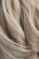 Champagne Blonde Rooted | A luxurious blend of beige blonde, champagne blonde, and dark ash blonde with highlights of platinum blonde throughout