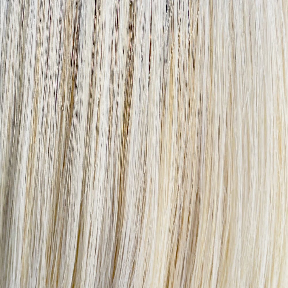 Close-up of long, straight, light blonde synthetic wig hair with subtle variations.