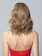 Back view of Demi Mono by Ellen Wille, a long wavy blonde bob wig with heat-friendly synthetic fibers.