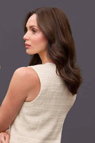 Woman wearing a 14-inch brown Remy human hair topper with a natural, wavy style and light-density coverage.