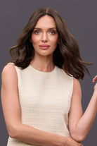 Woman wearing a 14-inch brown Remy human hair topper with a natural part and soft waves for lightweight coverage.