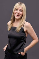 Model wearing 14-inch blonde Remy human hair topper with a seamless petite monofilament base for natural coverage.