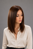 Woman wearing a cream colored blouse and Eileen 12" Remy European Human Hair Wig by PUSH Hair in color Mocha | An elegant and intense dark chocolate brown. Front view.