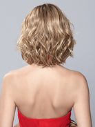 Back view of Elle Mono wavy blonde bob wig with textured layers and a mid-length silhouette.