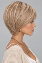 Woman wearing Emma Human Hair Wig by PUSH in color Light Champagne Crème Rooted with a cream v-neck sweater against a light grey background-right side view
