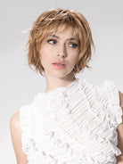 Woman wearing Escape Soft wig by Ellen Wille in Toffee Blonde Rooted | Front