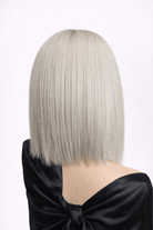 Éclipse | A cool-toned mix of soft silver and icy ash hues, expertly blended to create a natural, luminous finish. A darker, shadowed root adds contrast and realism.