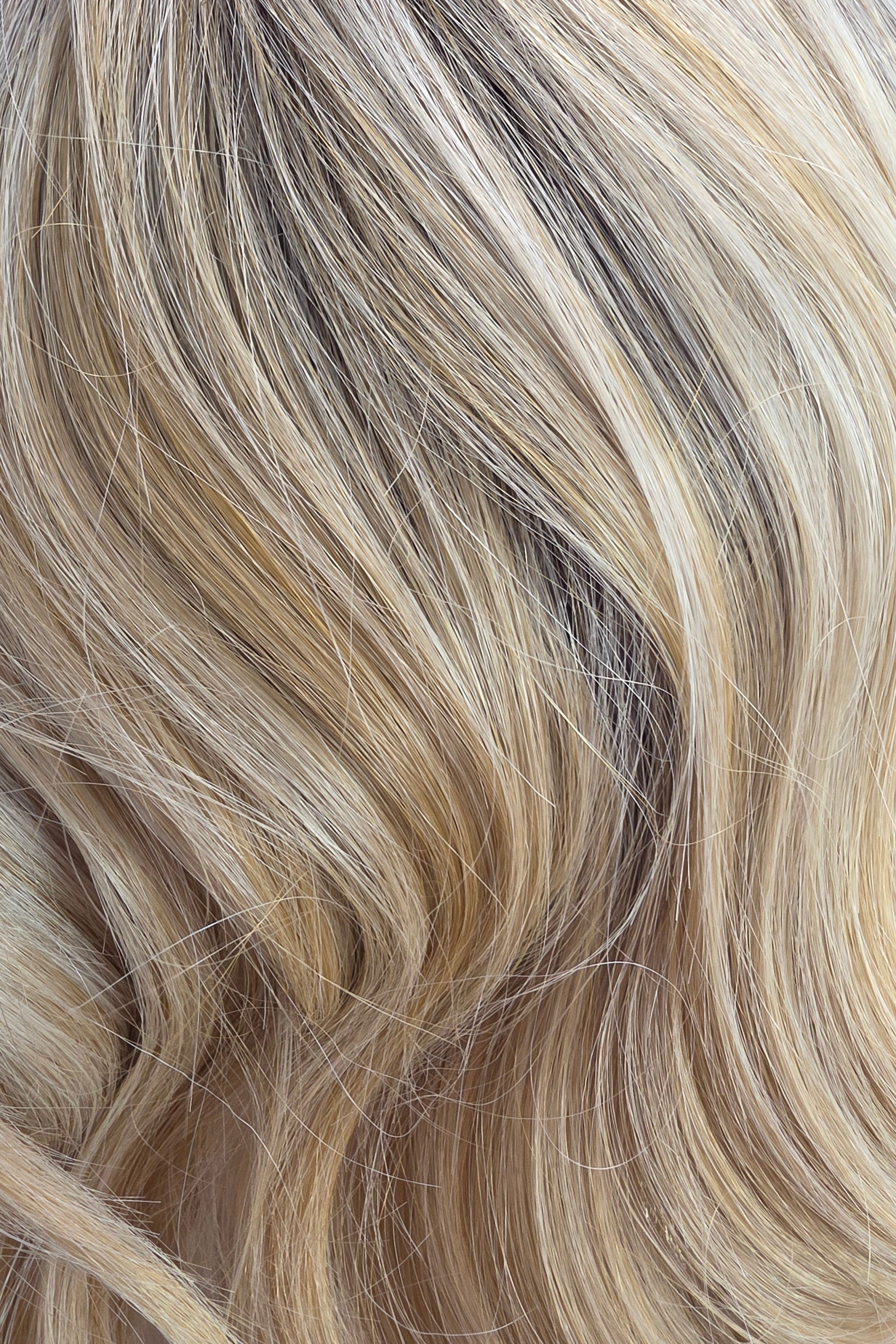 Golden Champagne Rooted | A medium neutral root melts into luminous champagne blonde ribbons with creamy vanilla highlights and soft golden beige dimension, creating a bright, natural-looking blonde with effortless depth and shine