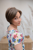 Woman with ear-length bob wig (Ivy by Jon Renau in 8RH14) side
