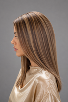 Woman wearing Jacey human hair wig by PUSH in color Belle Crème - Left side view