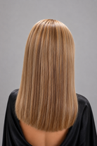 Woman wearing Jacey human hair wig by PUSH in color Blond Caramel - Back view.