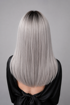 Éclipse | A cool-toned mix of soft silver and icy ash hues, expertly blended to create a natural, luminous finish. A darker, shadowed root adds contrast and realism.
