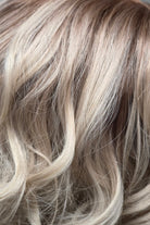 Lustre Rooted | A radiant platinum blonde that blends icy silver and pale pearl tones with a soft, natural root for subtle dimension