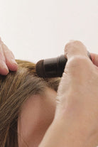 Image on woman having topper blended with natural hair with Love Match Powder Stick by Envy Color 8
