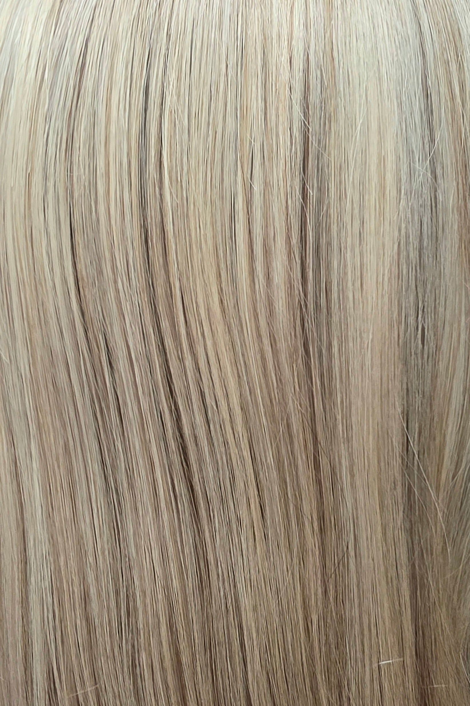 Santa Monica Blonde | A lightly rooted, cool-toned blonde featuring a dimensional blend of ashy beige, soft champagne, and pale blonde tones for a naturally highlighted finish.