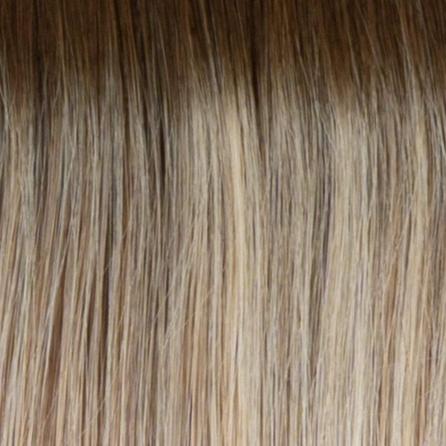 RH13/25SS | Shaded Praline | A rooted medium-light blonde / light brown shade built around praline. The darker root gives the color extra depth while the lengths show the lighter blended tones.