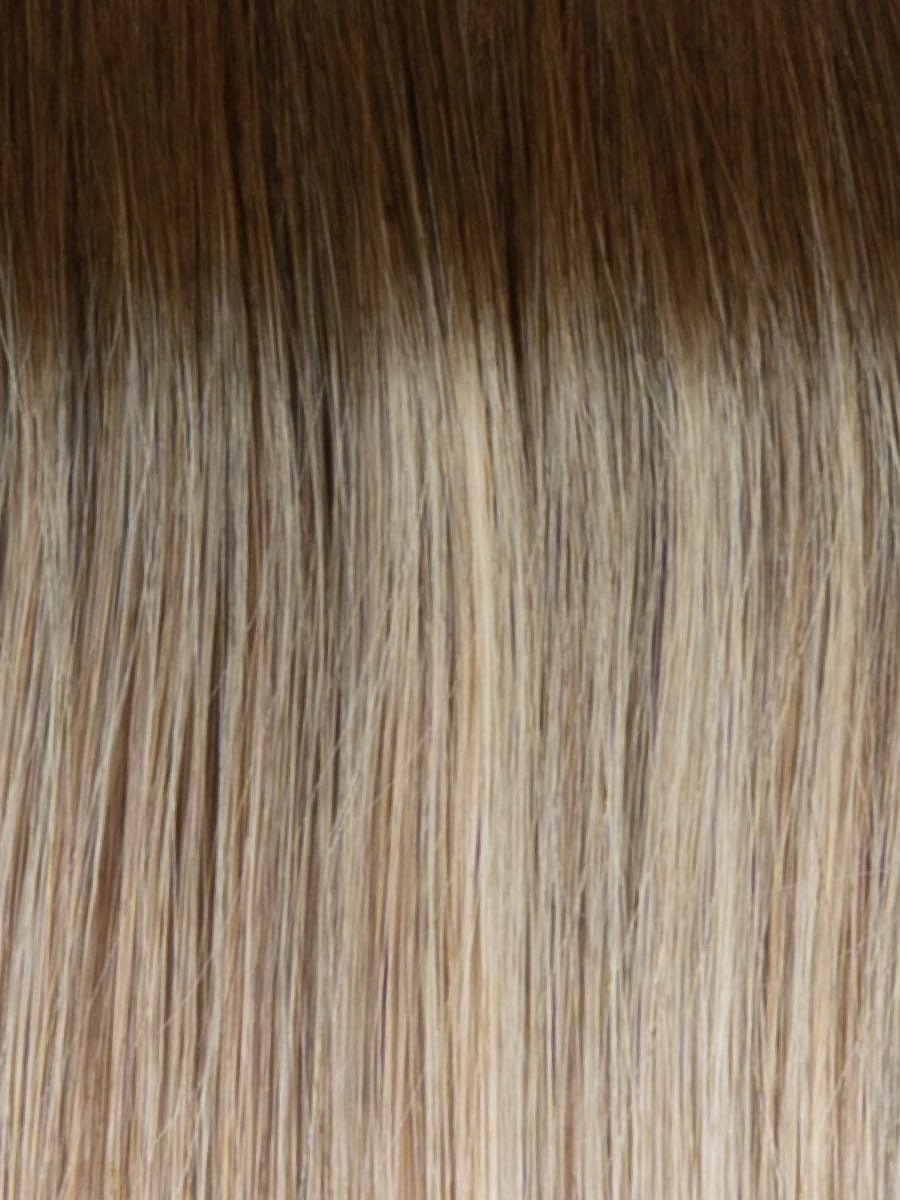 RH13/25SS | Shaded Praline | A rooted medium-light blonde / light brown shade built around praline. The darker root gives the color extra depth while the lengths show the lighter blended tones.