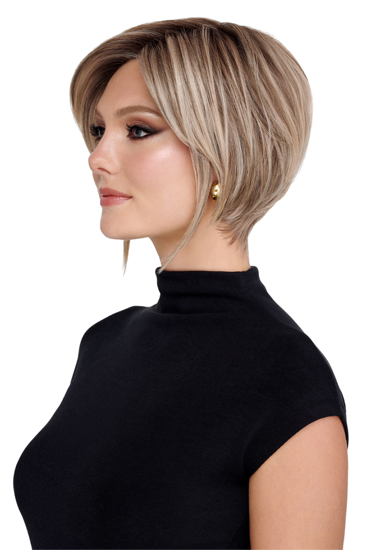 The Rogue by TressAllure short layered blonde bob wig with side-swept fringe and a tapered nape on a woman.
