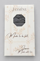 A packaged folded Wisdom Bamboo Turban shown in its retail box. The box is cream-colored with delicate floral line drawings and the text 'HOUSE OF JASMINE' at the top and 'Made to be felt'