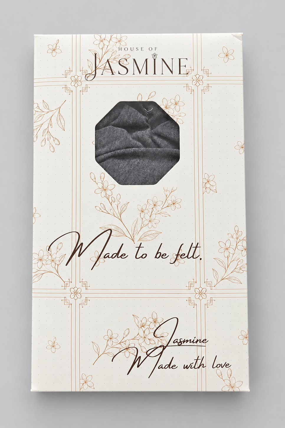A packaged folded Wisdom Bamboo Turban shown in its retail box. The box is cream-colored with delicate floral line drawings and the text 'HOUSE OF JASMINE' at the top and 'Made to be felt'