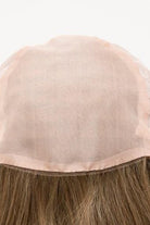 Abbey by Envy beige wig cap with brown hair on a white background - front view.