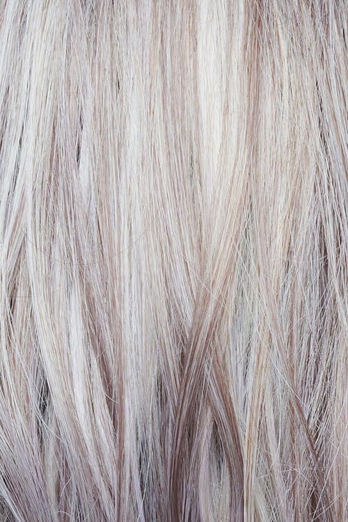 Frozen Mulberry | a stunning hair color that combines a pale white-grey platinum base with subtle lavender and frosted berry tones delicately woven throughout. This unique blend adds texture and elegance to the overall look.